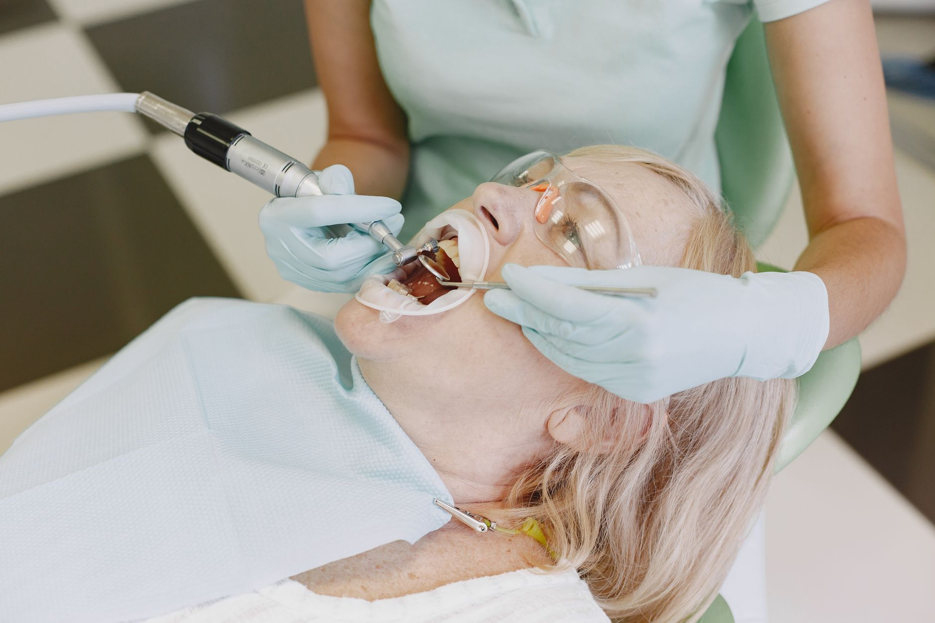 Dentist fitting a patient with a night guard for teeth grinding