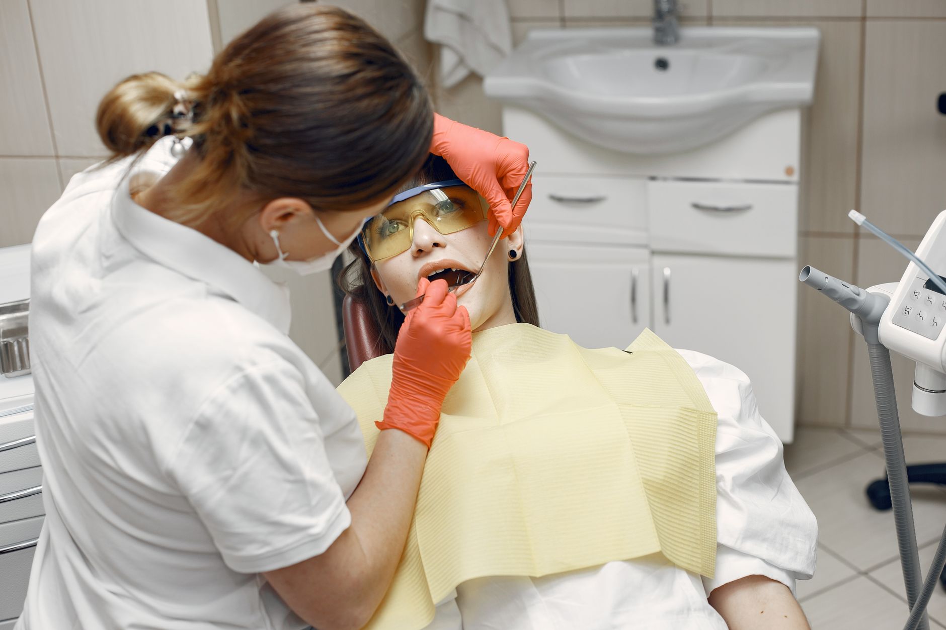 Dental patient relaxed in chair discussing sedation dentistry options with dentist