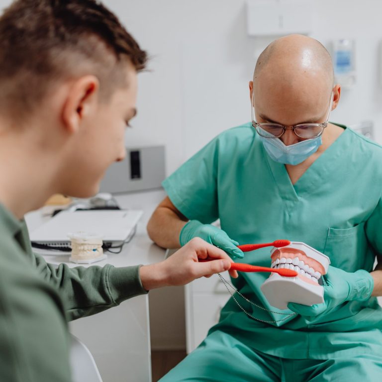 Family dentist advising a patient on how to choose a dentist