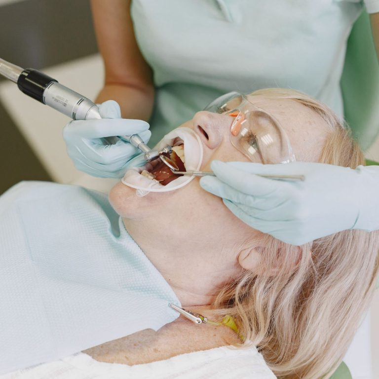 Dentist fitting a patient with a night guard for teeth grinding